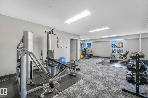 Common exercise room for building residents. - 419 396 Silverberry Road, Edmonton, AB - Indoor Photo Showing Gym Room