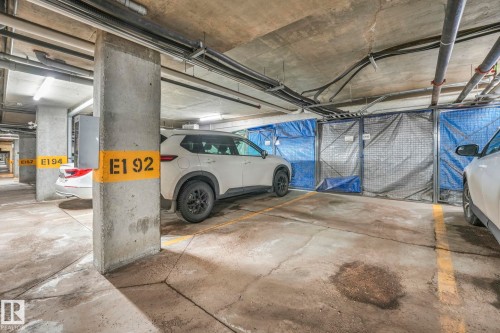 Heated underground parking with storage stall E192 - 419 396 Silverberry Road, Edmonton, AB - Indoor Photo Showing Garage