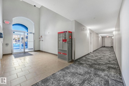 Community lobby featuring high vaulted ceiling - 419 396 Silverberry Road, Edmonton, AB - Indoor Photo Showing Other Room