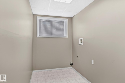 Laundry room in the basement - 2 Creekside Way, Spruce Grove, AB - Indoor