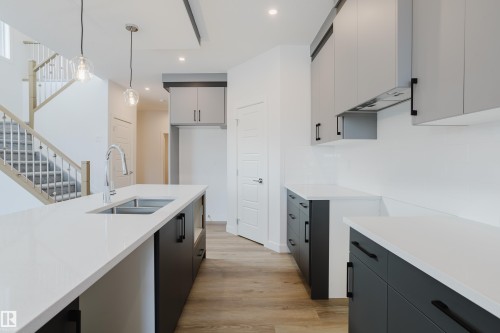 134 Mitchell Bend, Leduc, AB - Indoor Photo Showing Kitchen With Double Sink