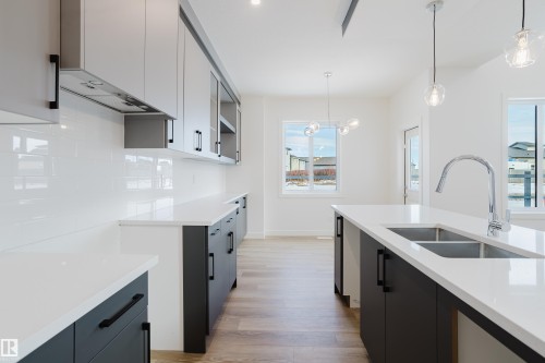 134 Mitchell Bend, Leduc, AB - Indoor Photo Showing Kitchen With Double Sink With Upgraded Kitchen