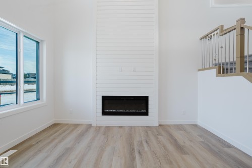 134 Mitchell Bend, Leduc, AB - Indoor Photo Showing Living Room With Fireplace