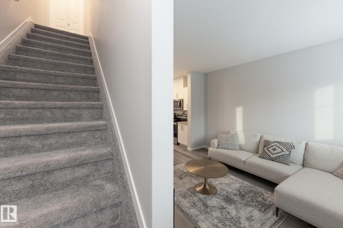 Stairs with baseboards and wood finished floors - 56 320 Secord Boulevard, Edmonton, AB - Indoor Photo Showing Living Room
