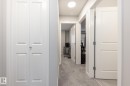 Hall with light carpet and baseboards - 56 320 Secord Boulevard, Edmonton, AB  - Indoor Photo Showing Other Room 