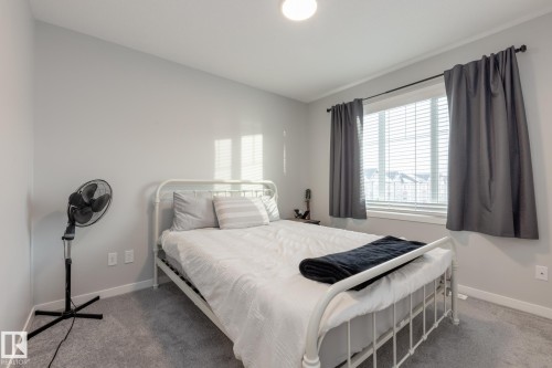 Bedroom with vaulted ceiling and carpet - 56 320 Secord Boulevard, Edmonton, AB - Indoor Photo Showing Bedroom