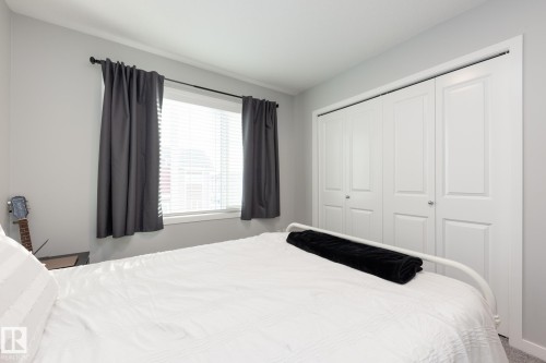 Carpeted bedroom featuring a closet - 56 320 Secord Boulevard, Edmonton, AB - Indoor Photo Showing Bedroom
