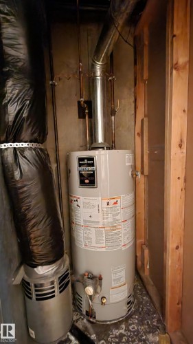 Utilities with water heater - 4709 106 Street, Edmonton, AB - Indoor Photo Showing Basement