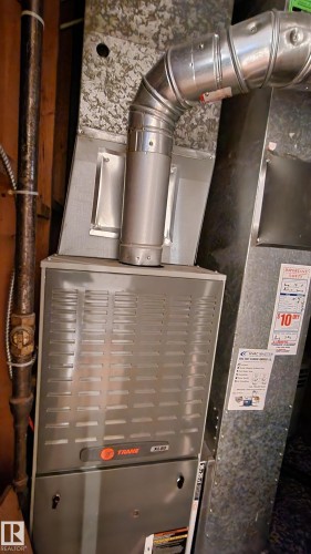 Utility room featuring heating unit - 4709 106 Street, Edmonton, AB - Indoor Photo Showing Basement