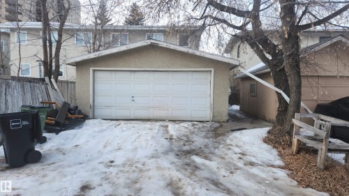 Snow covered garage with a garage - 4709 106 Street, Edmonton, AB - Outdoor With Exterior