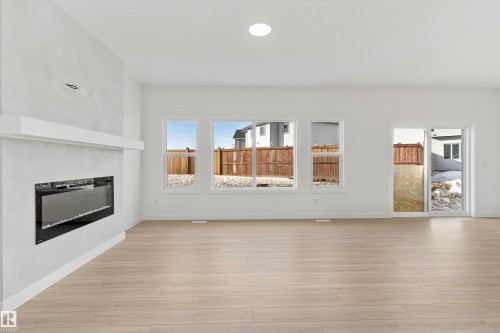 142 South Ravines Drive, Devon, AB - Indoor Photo Showing Living Room With Fireplace