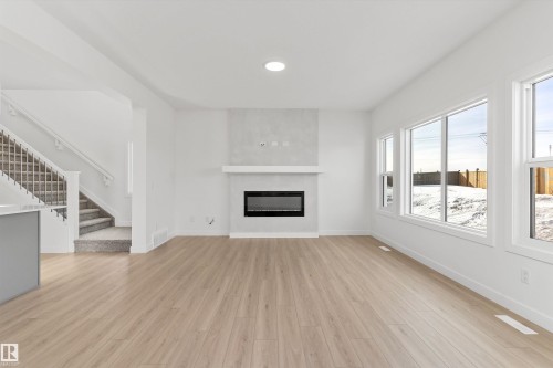 142 South Ravines Drive, Devon, AB - Indoor Photo Showing Living Room With Fireplace