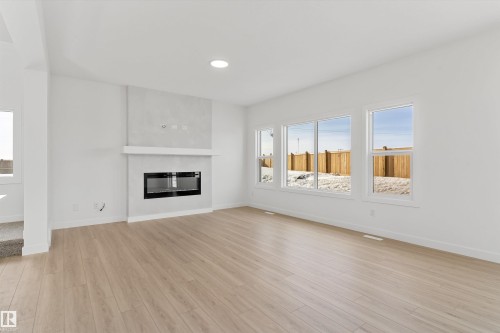 142 South Ravines Drive, Devon, AB - Indoor Photo Showing Living Room With Fireplace