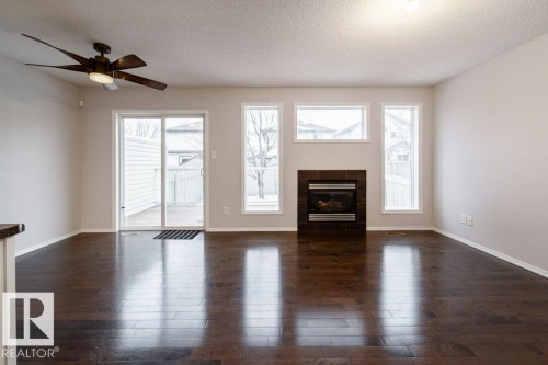 62 6304 Sandin Way, Edmonton, AB - Indoor Photo Showing Living Room With Fireplace