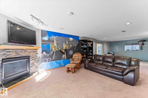 135 St. Andrews Drive, Stony Plain, AB - Indoor Photo Showing Living Room With Fireplace