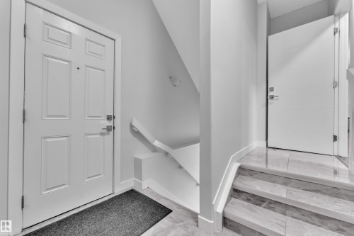 Entrance foyer with baseboards - 906 Berg Place, Leduc, AB - Indoor Photo Showing Other Room