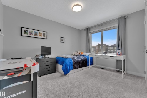 Bedroom with carpet - 906 Berg Place, Leduc, AB - Indoor Photo Showing Bedroom