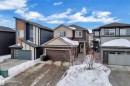 View of front of property with a garage, concrete driveway, and roof with shingles - 906 Berg Place, Leduc, AB  - Outdoor With Facade 