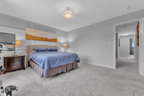 Carpeted bedroom with baseboards - 906 Berg Place, Leduc, AB - Indoor Photo Showing Bedroom