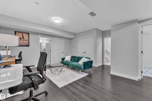 Office featuring wood finished floors and baseboards - 906 Berg Place, Leduc, AB - Indoor Photo Showing Office