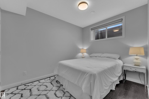 Bedroom featuring wood finished floors - 906 Berg Place, Leduc, AB - Indoor Photo Showing Bedroom