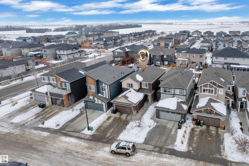 Snowy aerial view with a residential view - 906 Berg Place, Leduc, AB - Outdoor With View