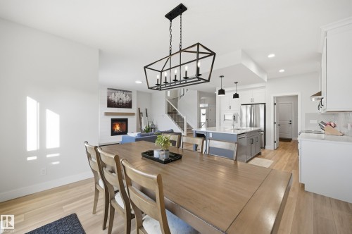 54 Willow Link, Fort Saskatchewan, AB - Indoor Photo Showing Dining Room With Fireplace