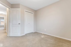 Unfurnished bedroom with carpet and a closet - 
