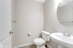 Half bathroom featuring toilet and tile patterned floors - 