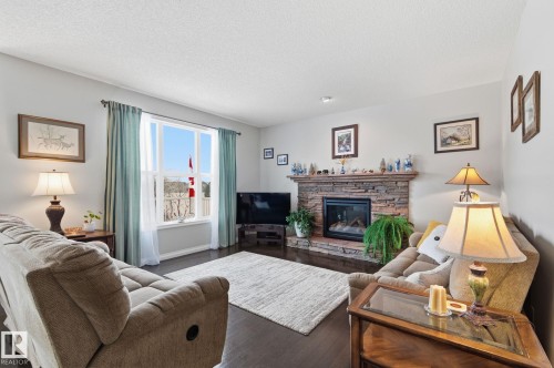 766 Hardy Point(E), Edmonton, AB - Indoor Photo Showing Living Room With Fireplace