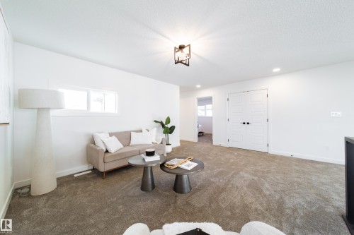 Living area with carpet flooring and recessed lighting - 34 Sun Meadows Cl, Stony Plain, AB - Indoor Photo Showing Other Room