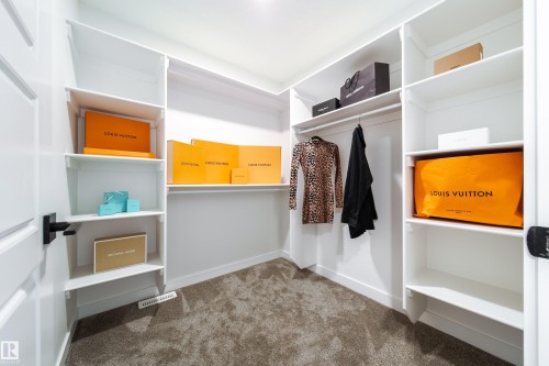 Walk in closet featuring dark colored carpet - 34 Sun Meadows Cl, Stony Plain, AB - Indoor With Storage
