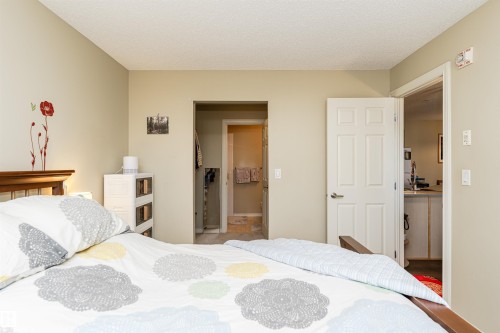 Bedroom featuring ensuite bath and a textured ceiling - 314 4403 23 Street, Edmonton, AB - Indoor Photo Showing Bedroom