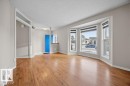 Unfurnished living room with light wood-type flooring and a textured ceiling - 736 Johns Road, Edmonton, AB  - Indoor Photo Showing Other Room 