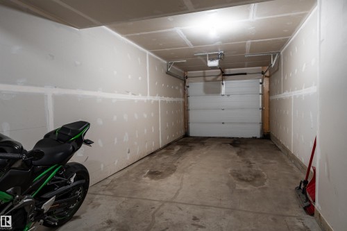 8 7385 Edgemont Way, Edmonton, AB - Indoor Photo Showing Garage