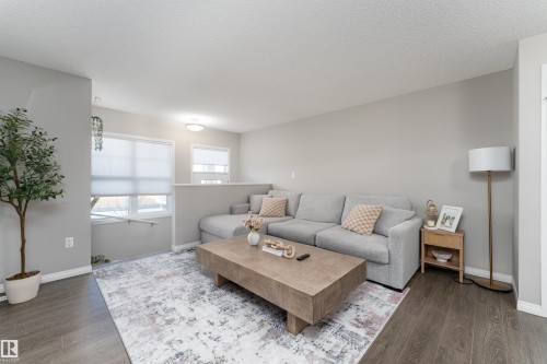 8 7385 Edgemont Way, Edmonton, AB - Indoor Photo Showing Living Room