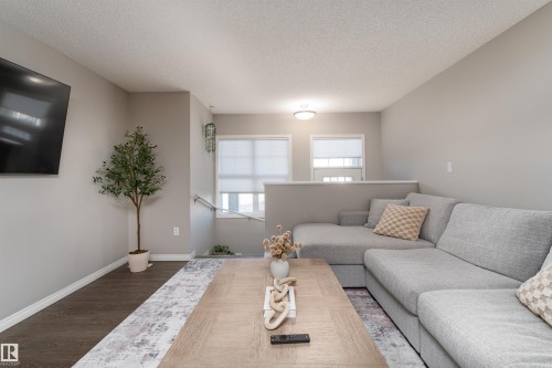 8 7385 Edgemont Way, Edmonton, AB - Indoor Photo Showing Living Room