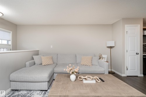 8 7385 Edgemont Way, Edmonton, AB - Indoor Photo Showing Living Room
