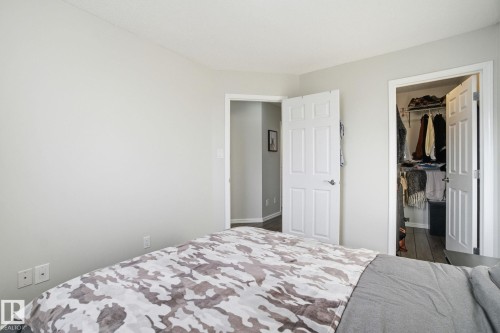 Bedroom with a spacious closet - 64 2004 Grantham Court, Edmonton, AB - Indoor Photo Showing Bedroom
