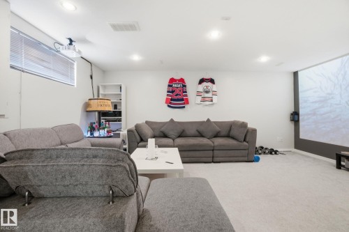 Carpeted living area featuring recessed lighting - 64 2004 Grantham Court, Edmonton, AB - Indoor