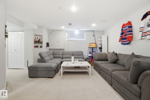 Living room featuring light colored carpet and recessed lighting - 64 2004 Grantham Court, Edmonton, AB - Indoor