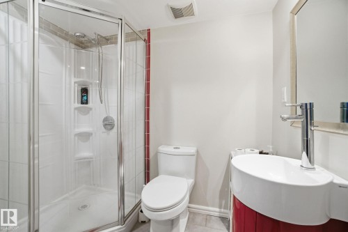 Bathroom featuring vanity, a stall shower, and tile patterned floors - 64 2004 Grantham Court, Edmonton, AB - Indoor Photo Showing Bathroom