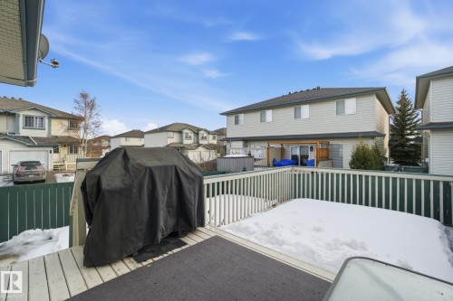 Wooden terrace featuring a residential view and grilling area - 64 2004 Grantham Court, Edmonton, AB - Outdoor With Deck Patio Veranda With Exterior