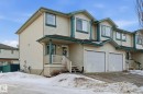 View of front of house featuring an attached garage, a porch, and concrete driveway - 64 2004 Grantham Court, Edmonton, AB  - Outdoor 