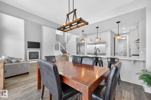 8810 24 Avenue, Edmonton, AB - Indoor Photo Showing Dining Room With Fireplace