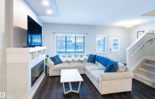 888 Cy Becker Drive, Edmonton, AB - Indoor Photo Showing Living Room With Fireplace