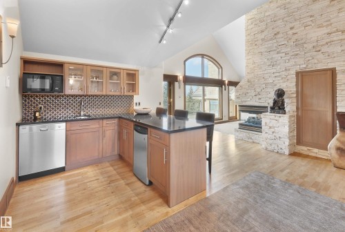 56 Windermere Drive, Edmonton, AB - Indoor Photo Showing Kitchen With Fireplace