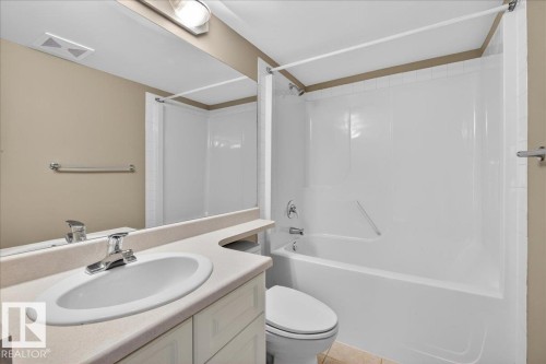 Full bath with vanity and tub / shower combination - 402 10649 Saskatchewan Drive, Edmonton, AB - Indoor Photo Showing Bathroom