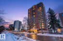 Snow covered property with a view of apartment building / complex - 402 10649 Saskatchewan Drive, Edmonton, AB  - Outdoor With Facade 