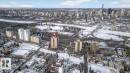 Snowy aerial view featuring a view of city - 402 10649 Saskatchewan Drive, Edmonton, AB  - Outdoor With View 